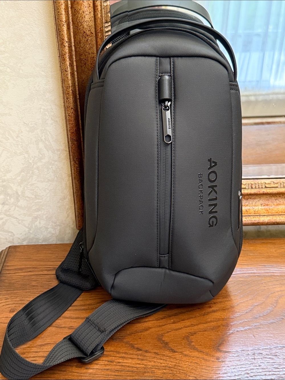 New without tag. Black Men’s Sling AOKING Backpack — Everyday Crossbody Carry.
